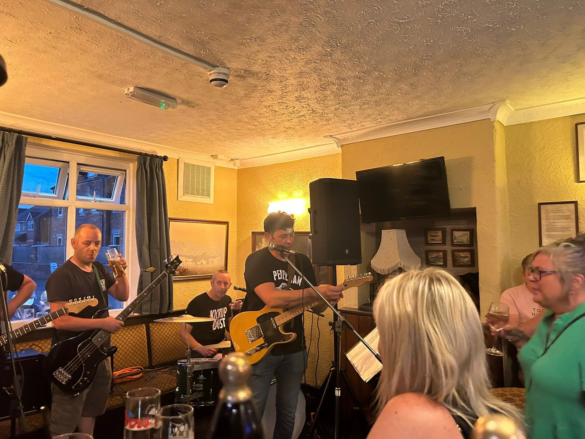 Musicians performing inside the Fenton Flyer
